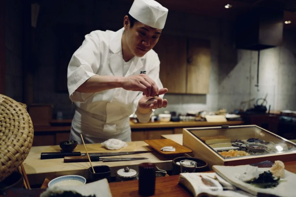 sushi chef in chef suit